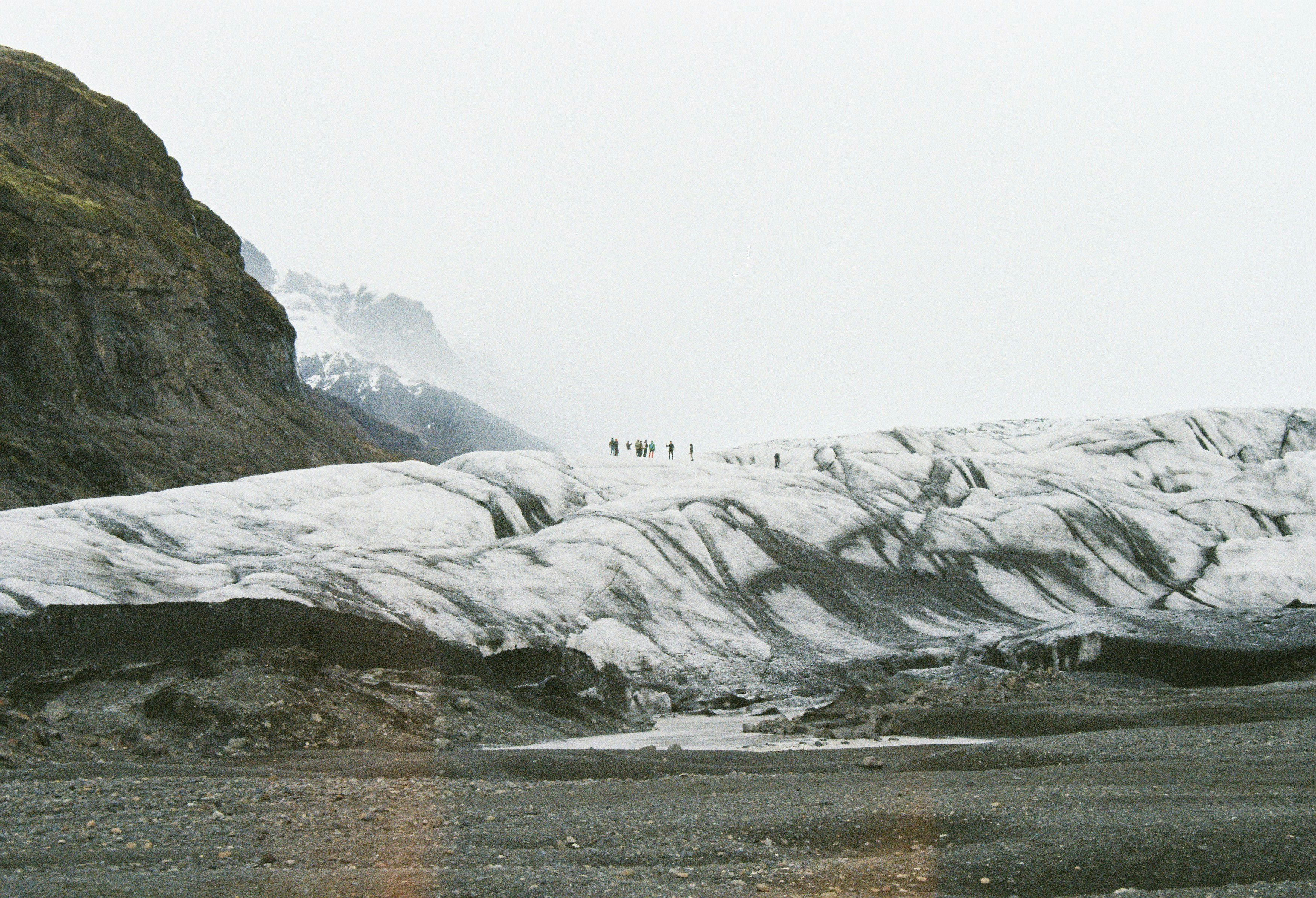 people standing on snow covered mountains during daytime